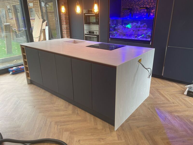 grey-island-unit-with-quartz-worktop-under-construction What's included when we fit your quartz worktop