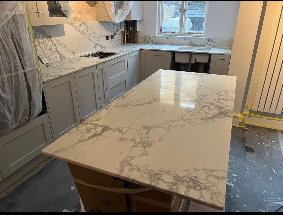 grey-marble-worktop-mid-installation-plastic-wrapping What's Included in a West Bridgford Vinyl Wrap, and What Isn't